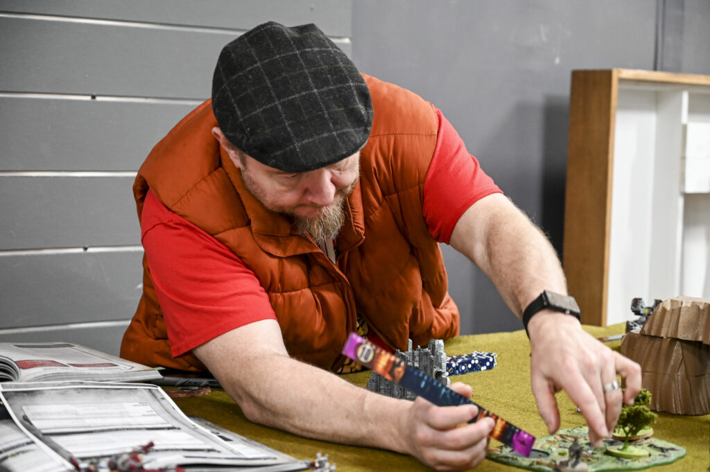 Dave Brown plays the game “Warhammer 40,000” at Four Horseman in the Morgantown Mall on Saturday.