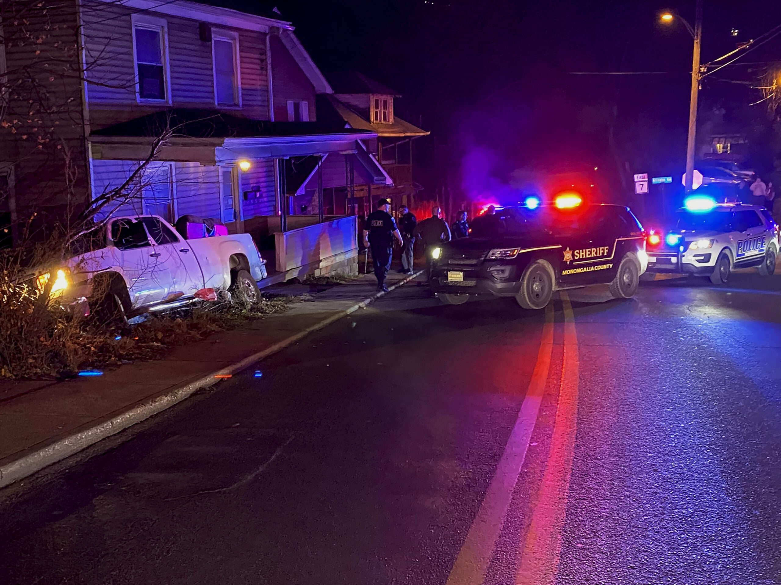 Officers from Westover, Morgantown, Mon County Sheriff's Department and West Virginia State Police were involved in a high speed chase Monday night that started in Westover and ended with a wreck on Brockway Avenue. A white pickup truck involved in a chase rests against a porch it struck after it wrecked on Brockway Avenue Monday night. According to scanner traffic, the truck was stolen out of Florida.