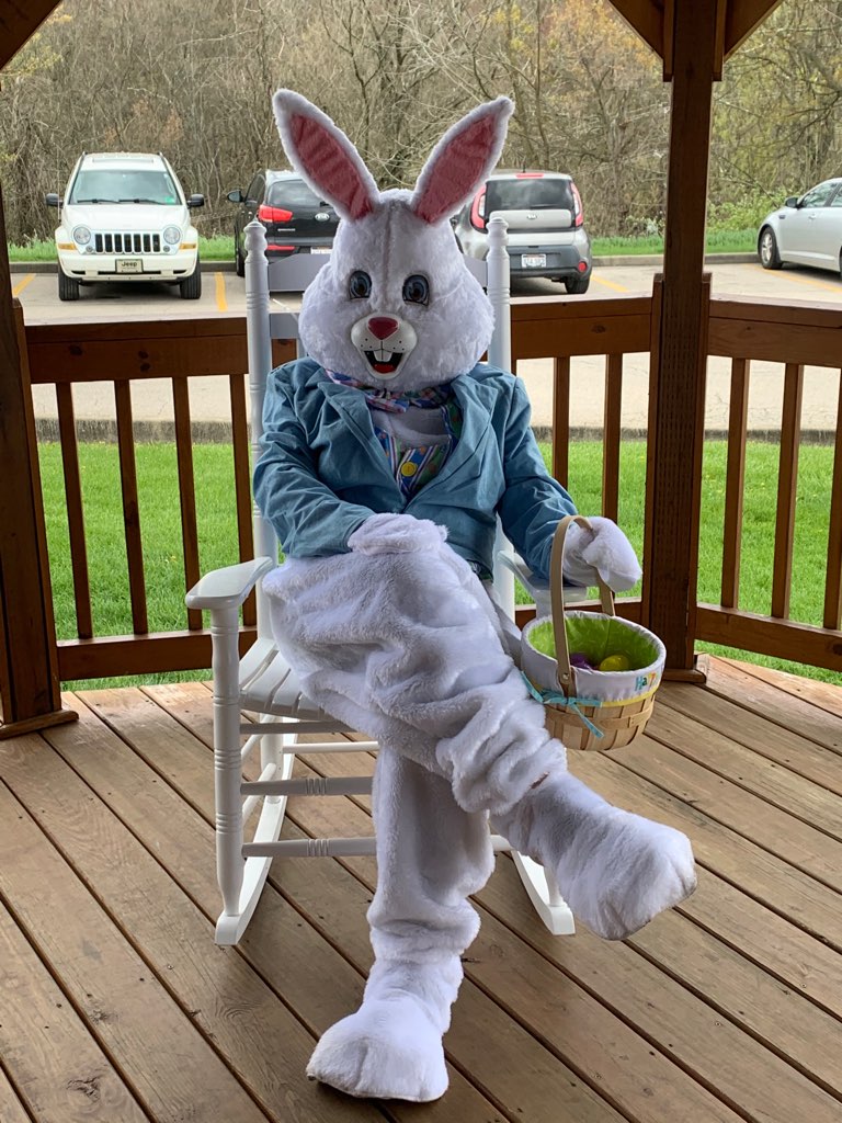 easter bunny sits on a porch