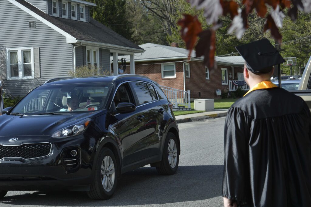 Seniors wave as residents drive by