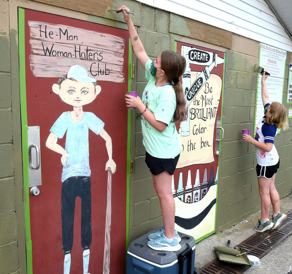 girl scouts painting wall