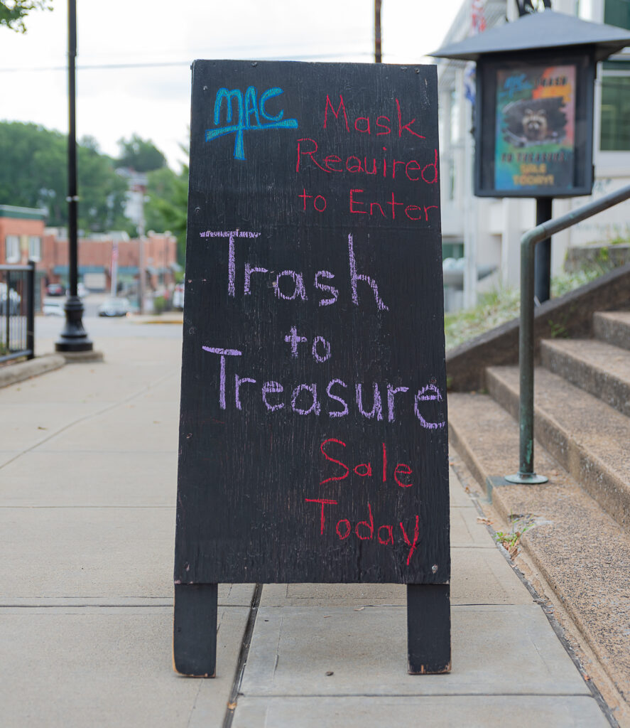 trash to treasure sign on sidewalk