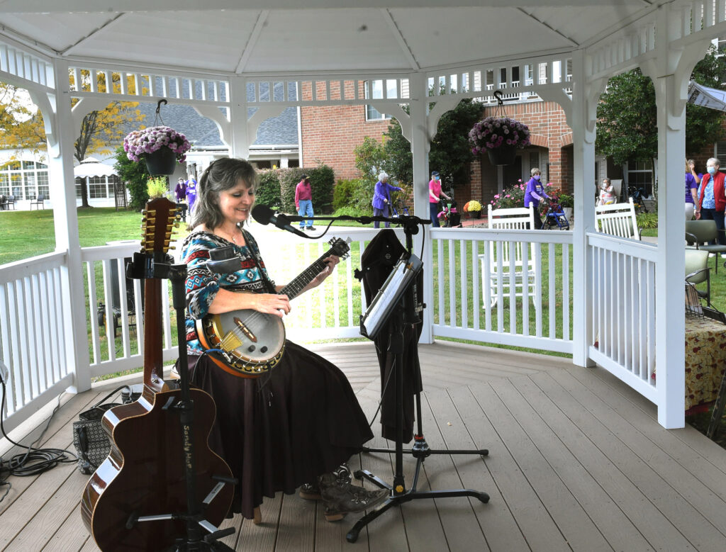 Sandy Lusco Huffman provides musical accompanyment