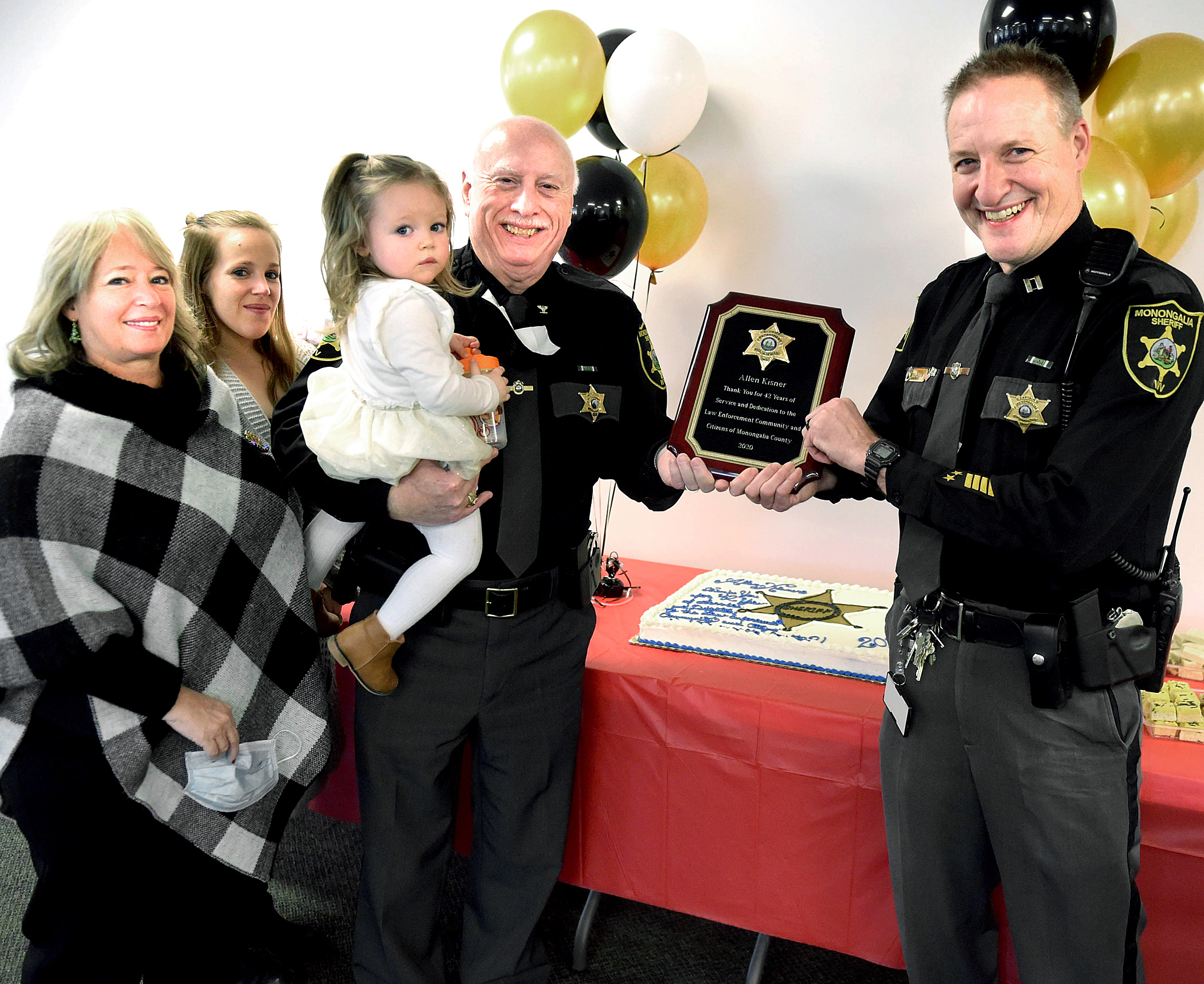 Capt. presents former Sheriff Al Kisner with plaque