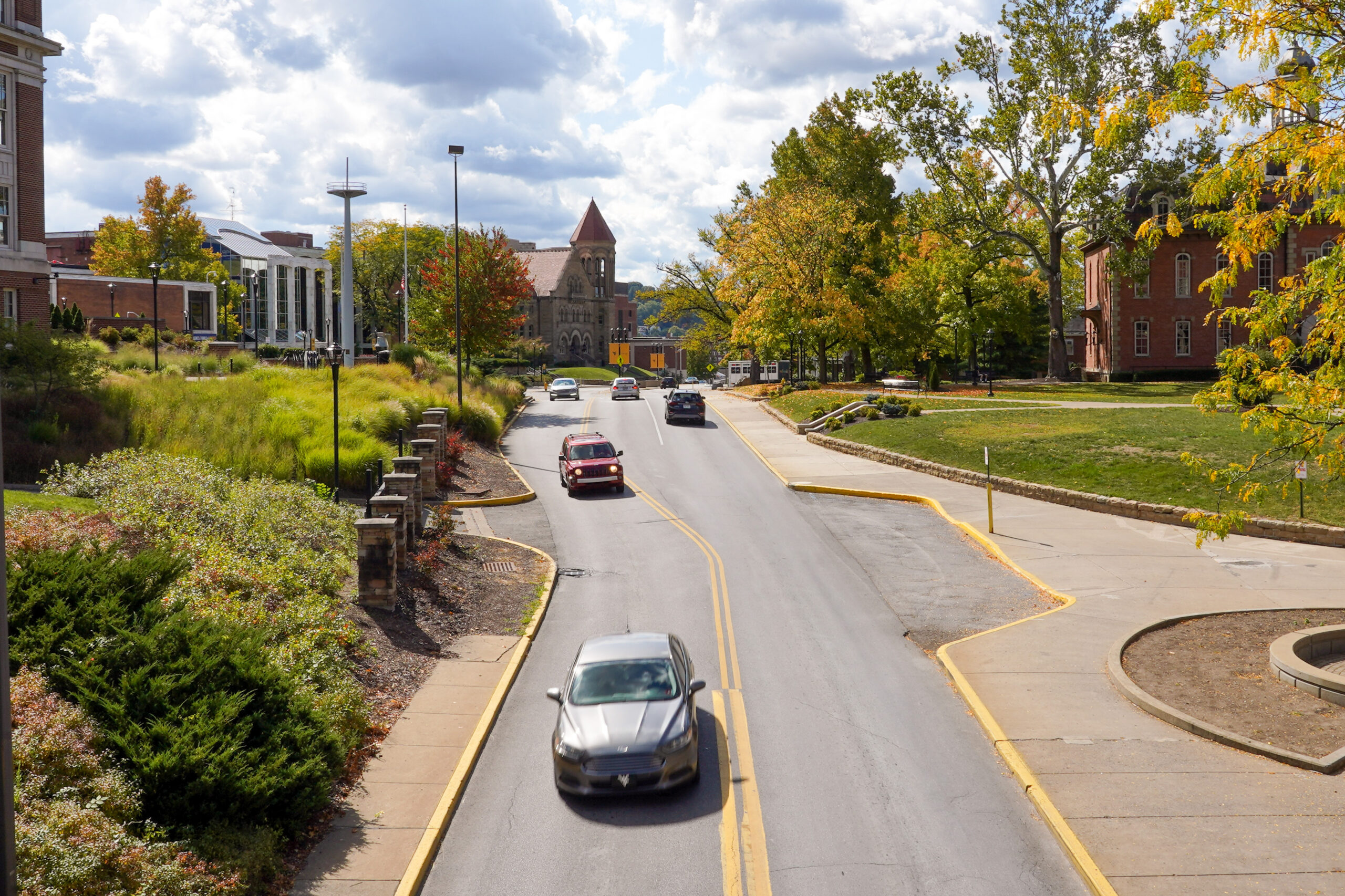 cars drive through downtown Morgantown campus