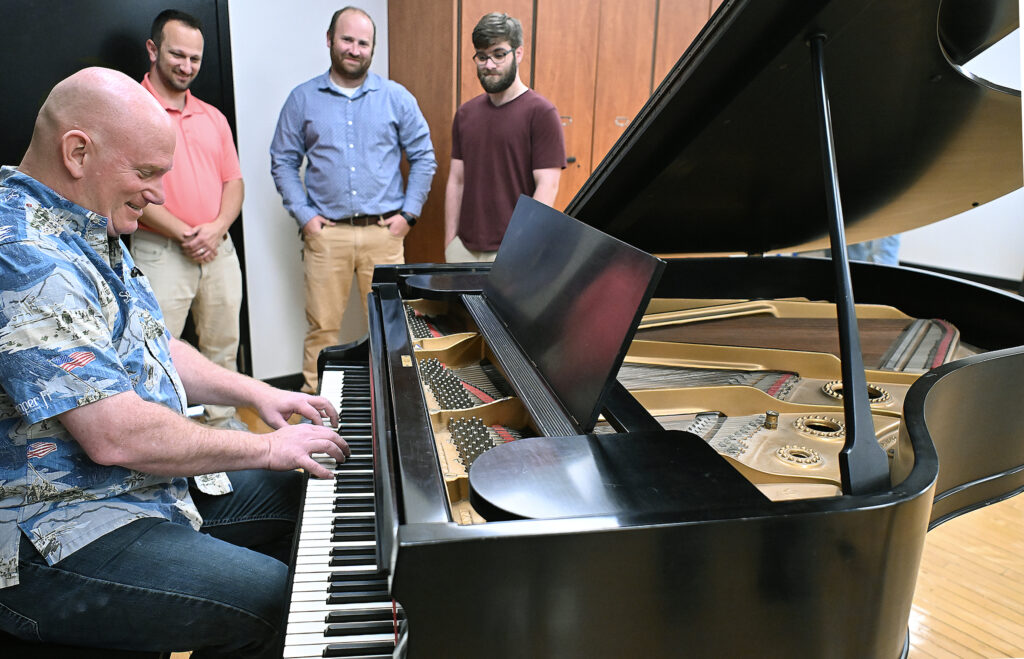 Key of Love: Renowned musician Peter Wilson donates family’s piano to alma mater